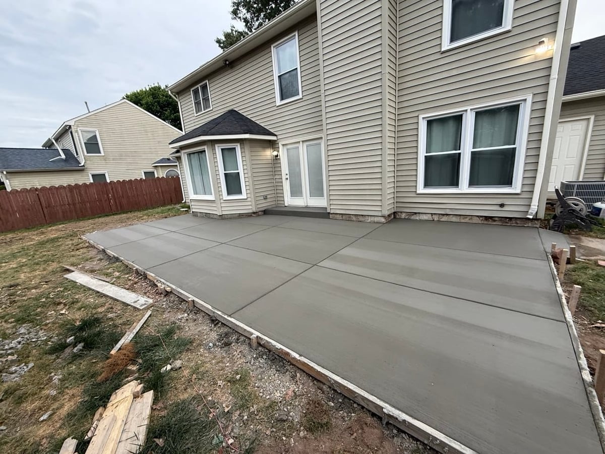 Finished broom-finish backyard concrete patio with control joints — Hampton Roads, VA