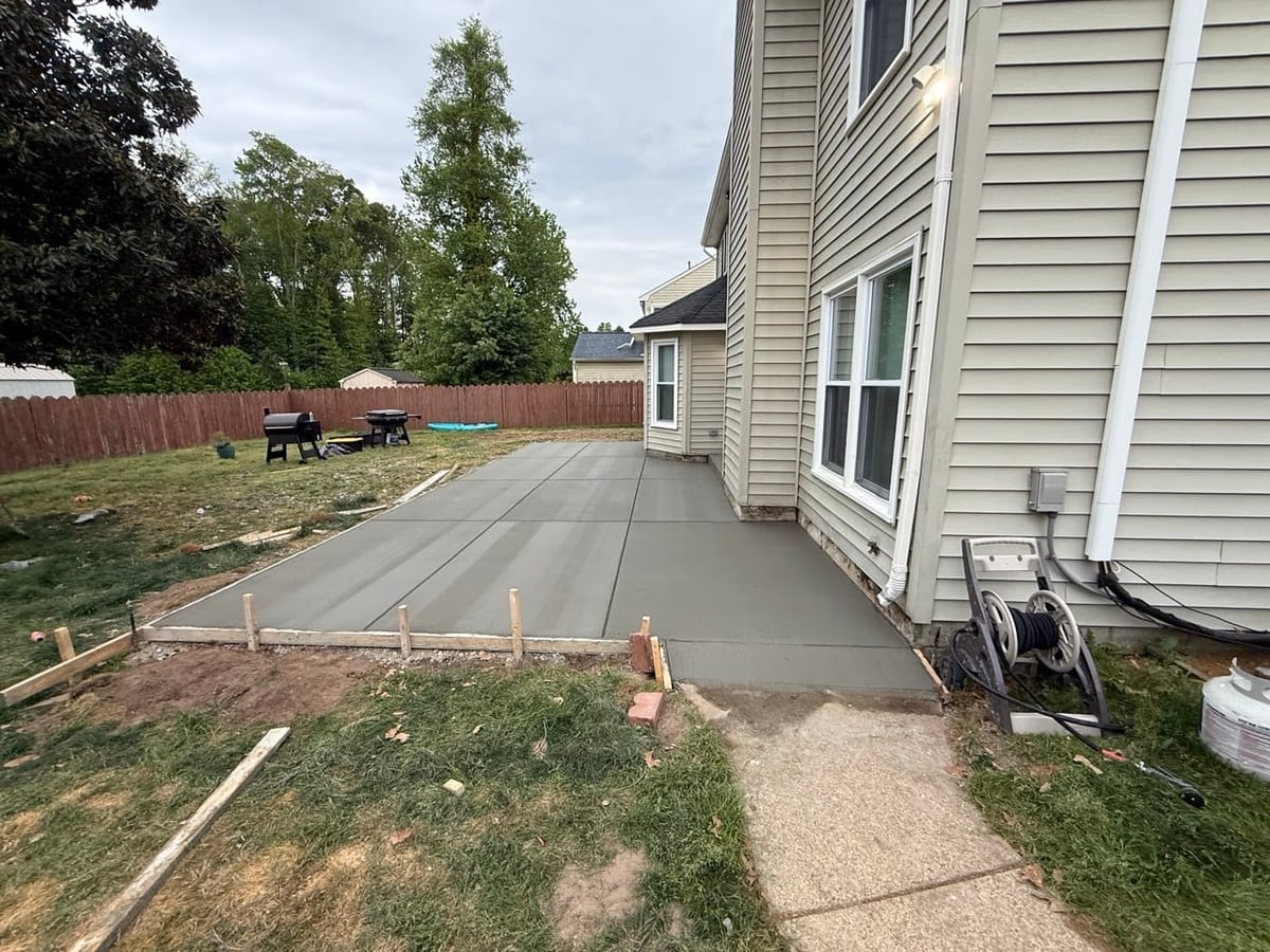 Fresh-poured backyard concrete patio in forms — Hampton Roads, VA