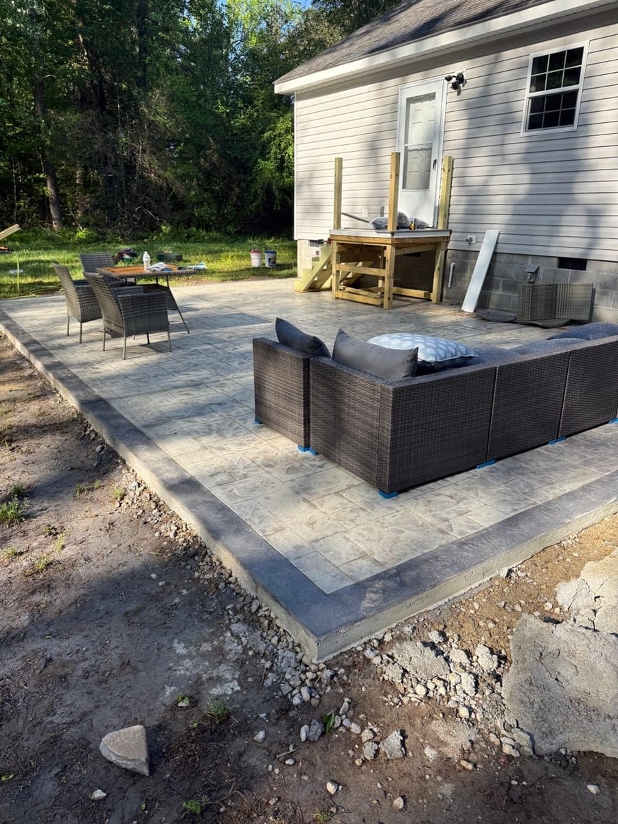 Stamped concrete patio with tile pattern and contrast border — Hampton Roads, VA